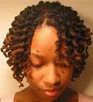 Image of black female with a twist out hairstyle