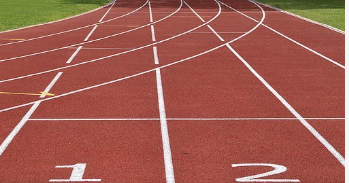 A track for athletics with the numbers 1 and 2 and curving lanes.